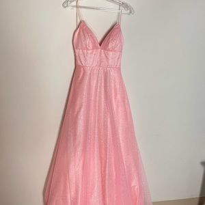 It’s a pink ball dress… very beautiful and has pockets